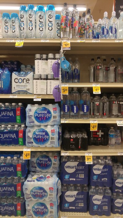 Image of different brands of bottled water.